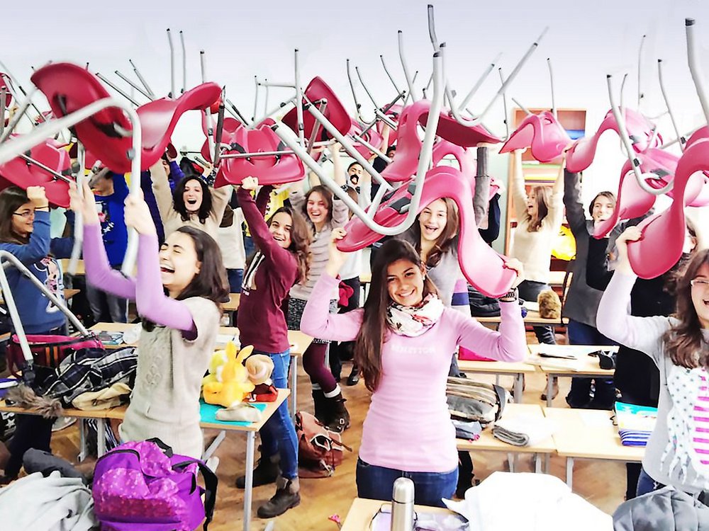 Image: Laughing pupils in classroom with chairs